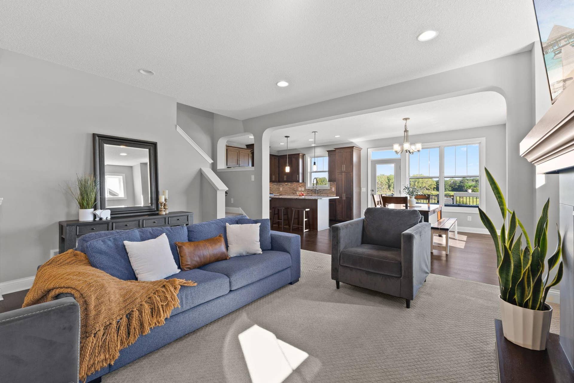 Living Room opens to Dining and Kitchen