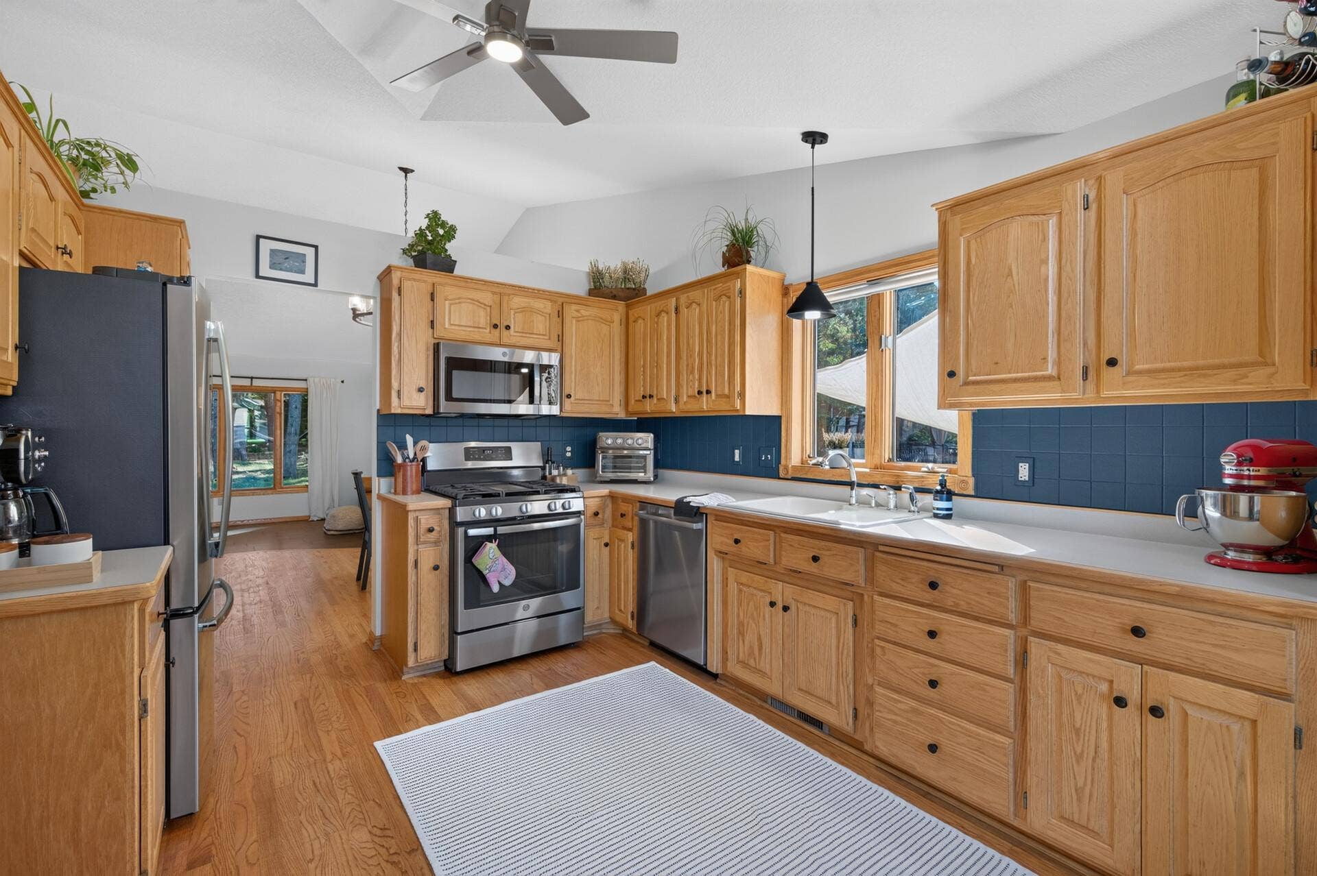 5956 Norway Pine Court, White Bear Lake, MN 55110 Open eat-in kitchen features newer stainless steel appliances and plenty of cabinetry.