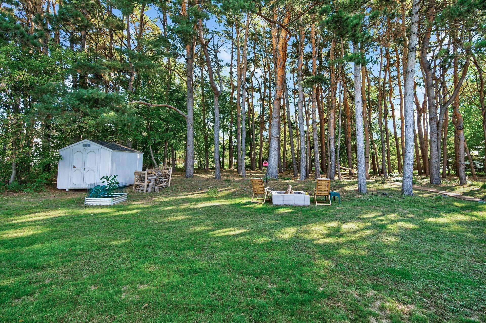 5956 Norway Pine Court, White Bear Lake, MN 55110 Mature trees and a backyard shed add to the property's storage, privacy, and up-north feel.