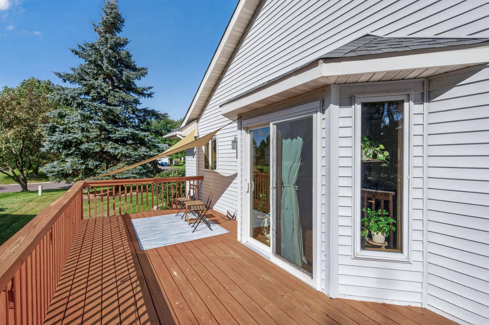 5956 Norway Pine Court, White Bear Lake, MN 55110 Step outside to the spacious deck overlooking the peaceful, tree-lined backyard.