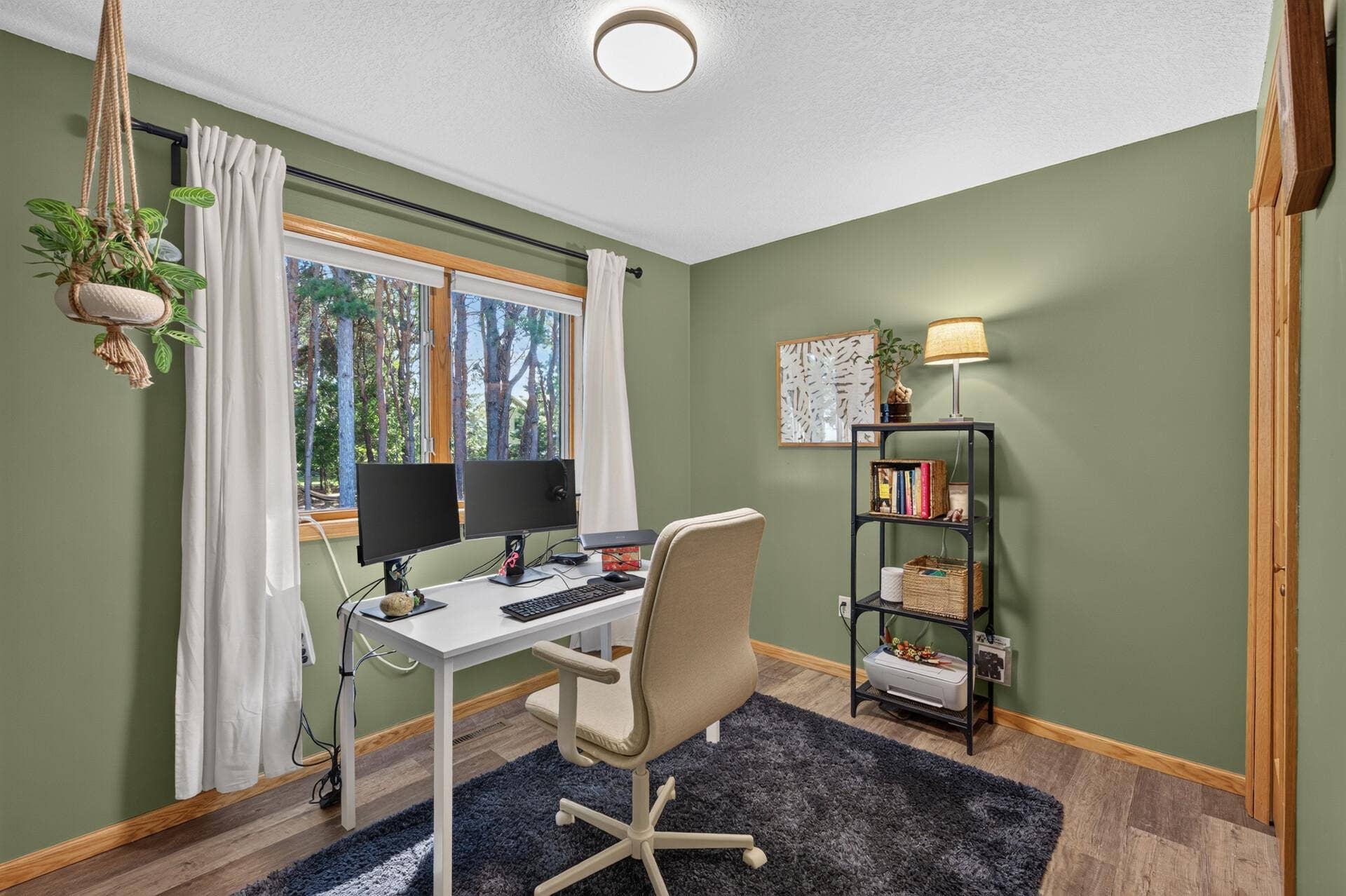 5956 Norway Pine Court, White Bear Lake, MN 55110 Versatile upper-level bedroom currently set up as a home office overlooking the trees.