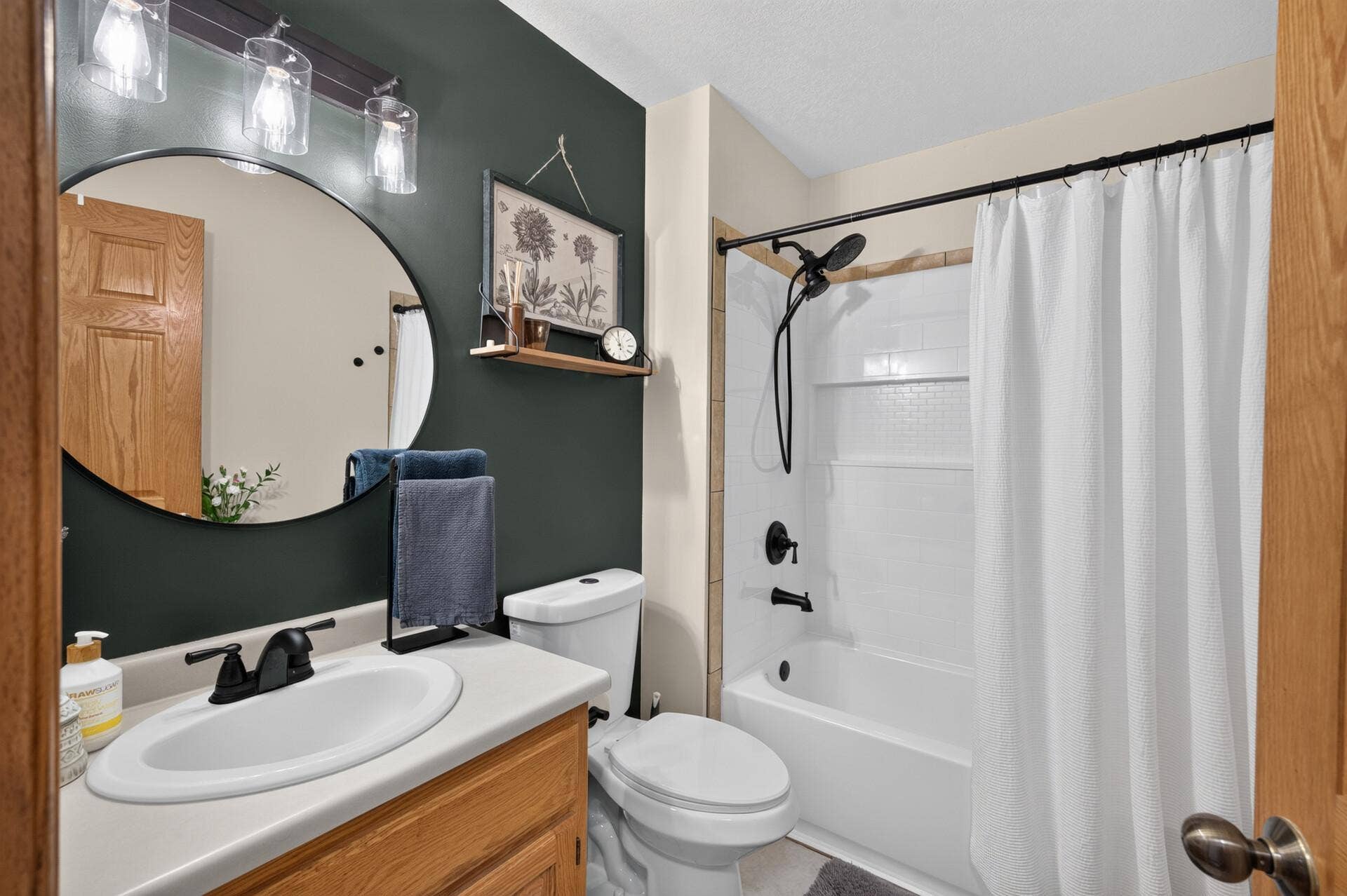 5956 Norway Pine Court, White Bear Lake, MN 55110 Updated full bath features a fresh, modern look with contrasting finishes.