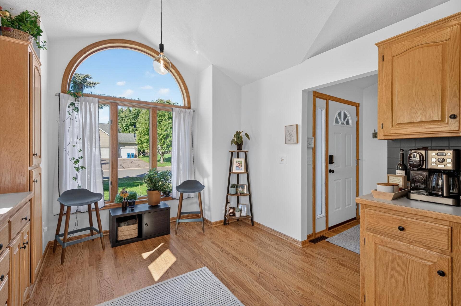 5956 Norway Pine Court, White Bear Lake, MN 55110 Sun-filled kitchen and dining area with beautiful arched windows adding character and natural light.