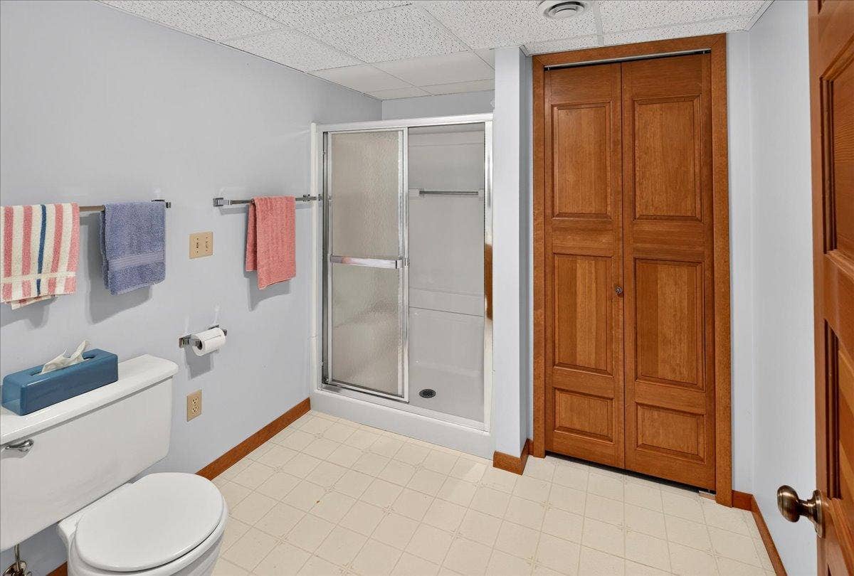 Lower Level 3/4  Bathroom with extra linen closet for all your bathroom storage needs
