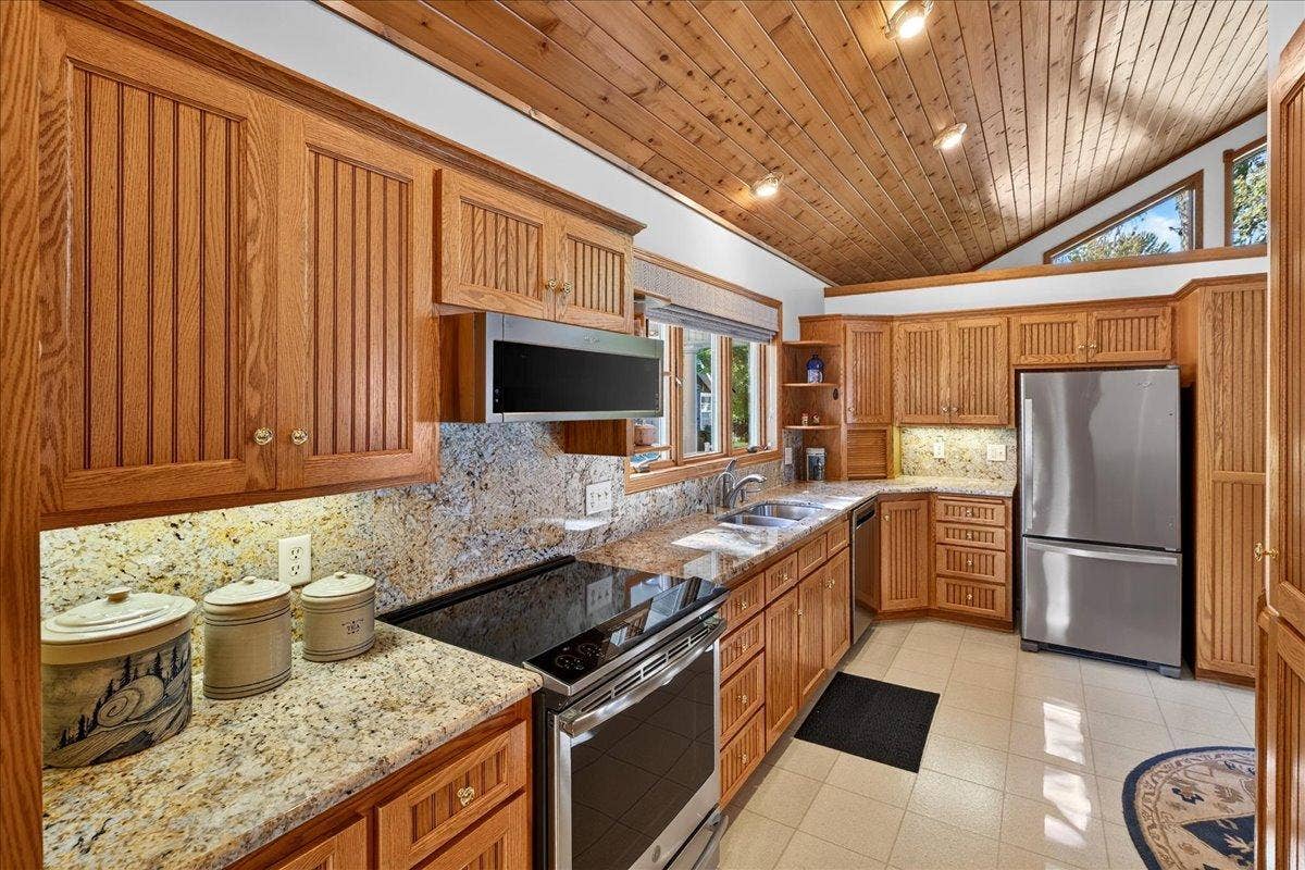 Granite Kitchen with Abundant Cabinet Storage at 12500 Melody Lane
