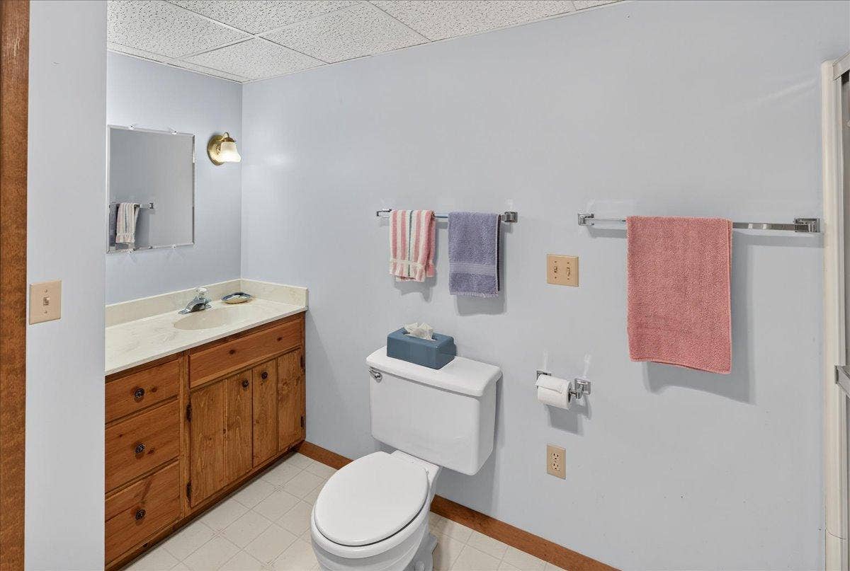 Vanity with marble counter top and large mirror