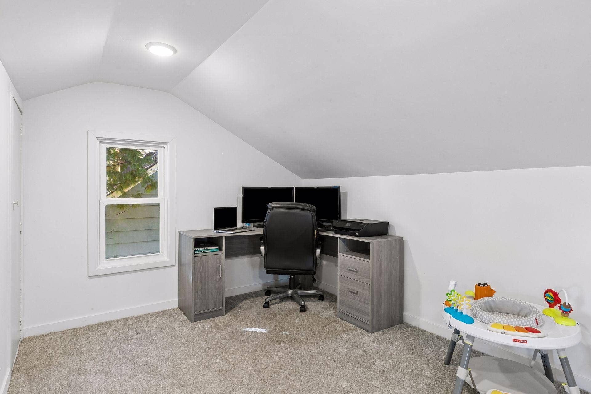 Additional view of the oversized upper-level bedroom highlighting the dedicated home-office area and flexible floor plan.