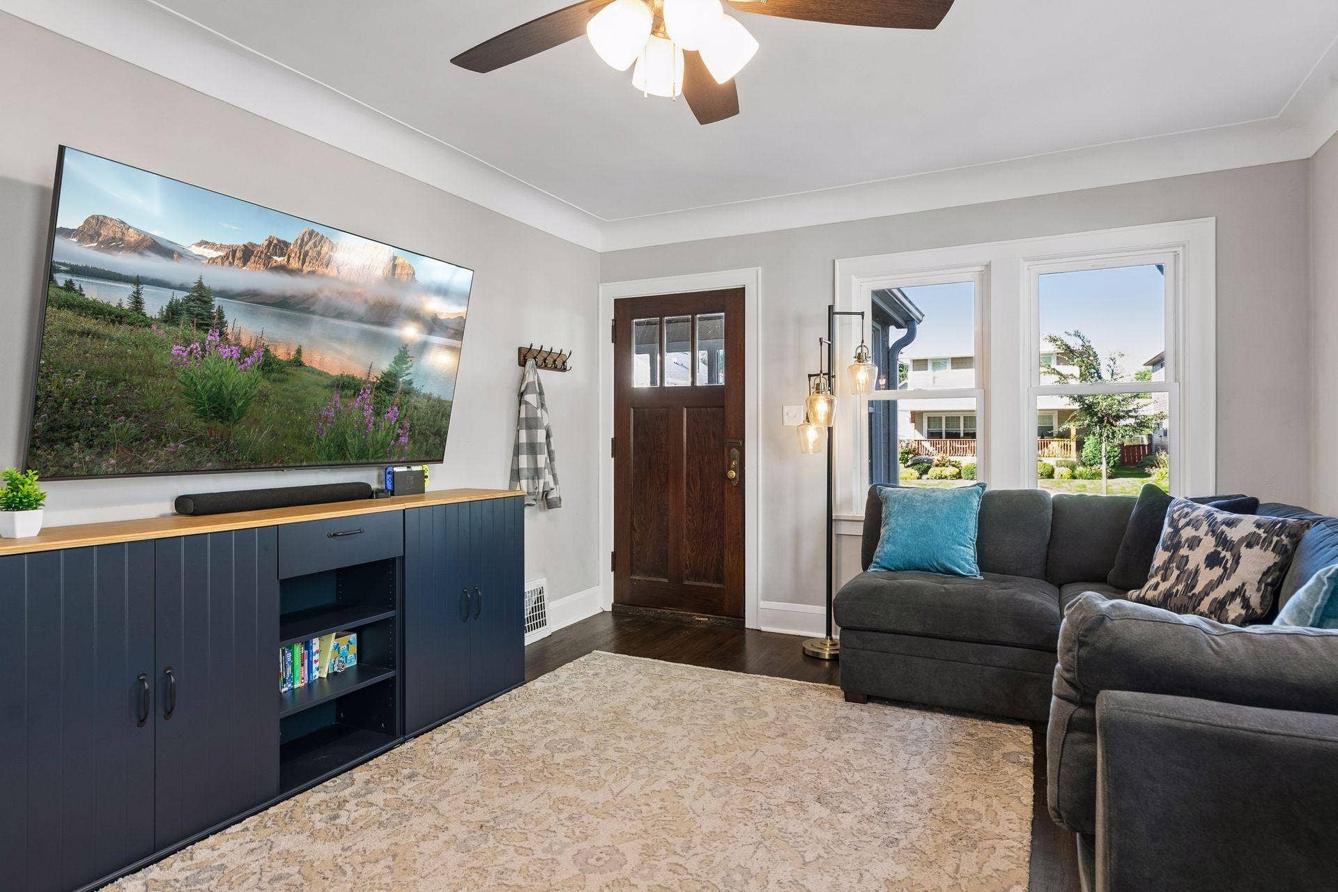 Spacious living room showcases hardwood flooring, classic character, and a comfortable layout for everyday living and entertaining.