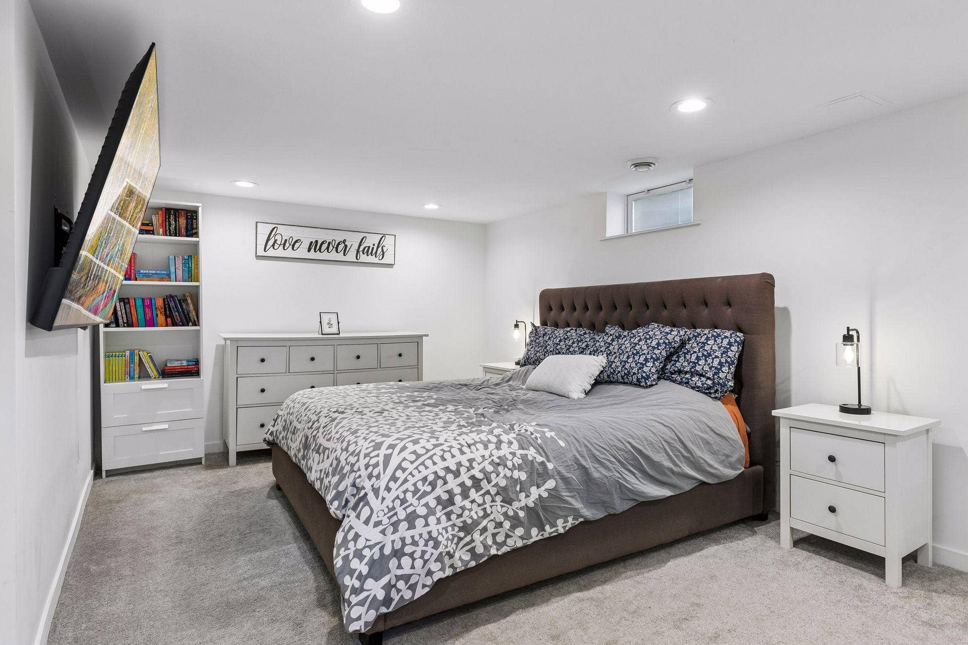 Finished lower-level family room offers additional living space and is currently used as a bedroom.
