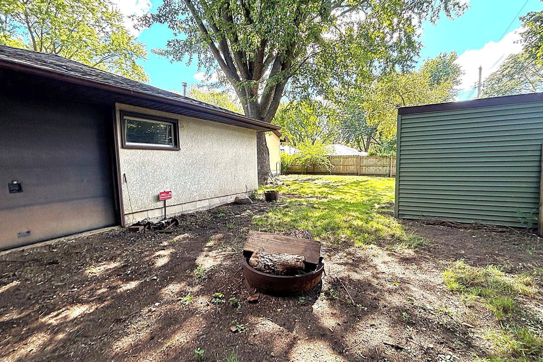 Pull through garage and fire pit area.
