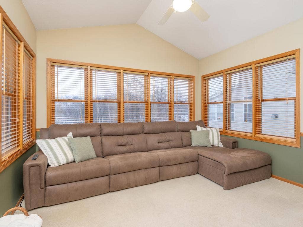 15344 64th Place N, Maple Grove, MN 55311 Vaulted Four-Season Porch opens out to the deck with amazing views overlooking the backyard and wetlands!