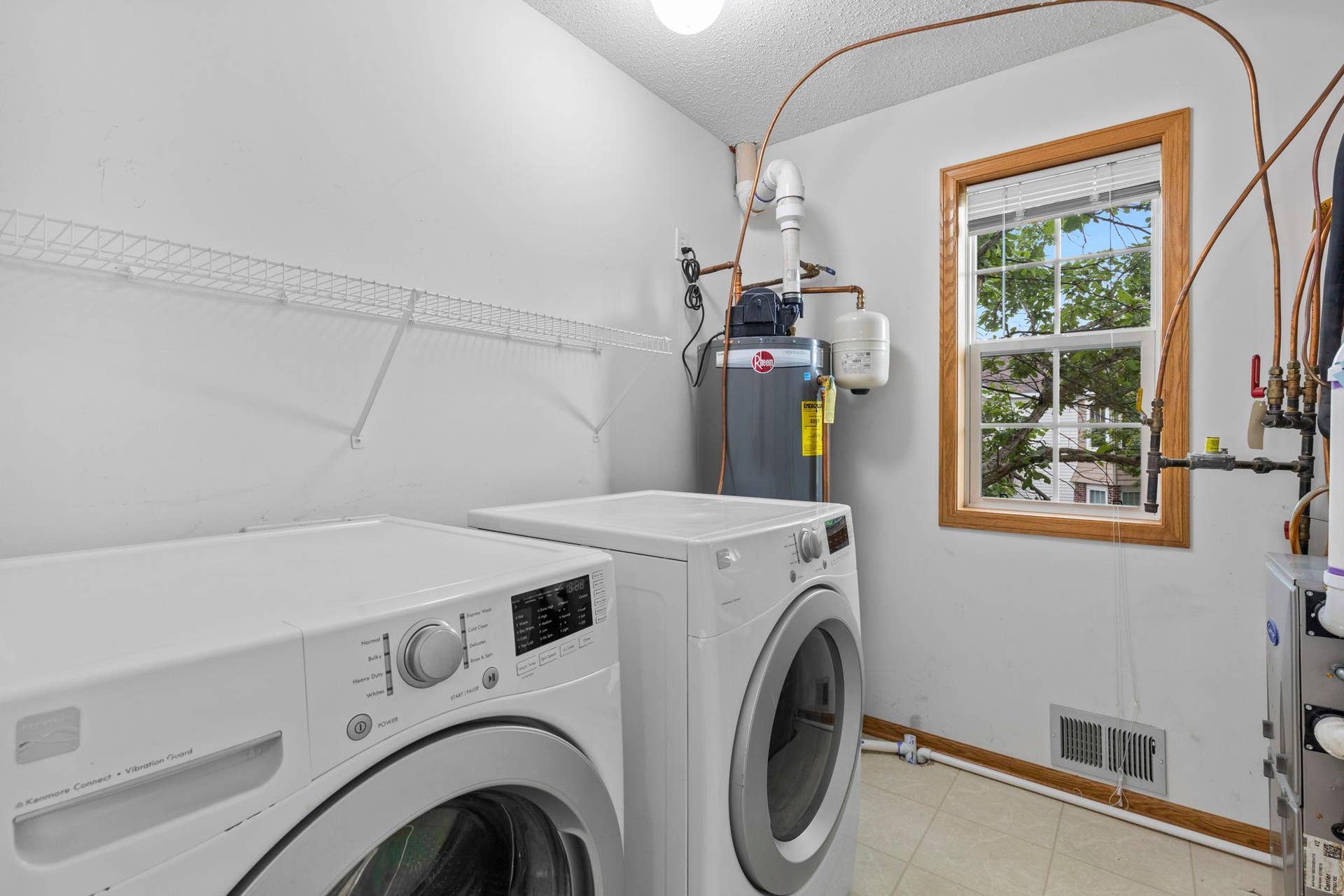 1626 Woodlynn Avenue, #1, Maplewood, MN 55109 A convenient central laundry room with front-loading washer and dryer is located nearby.