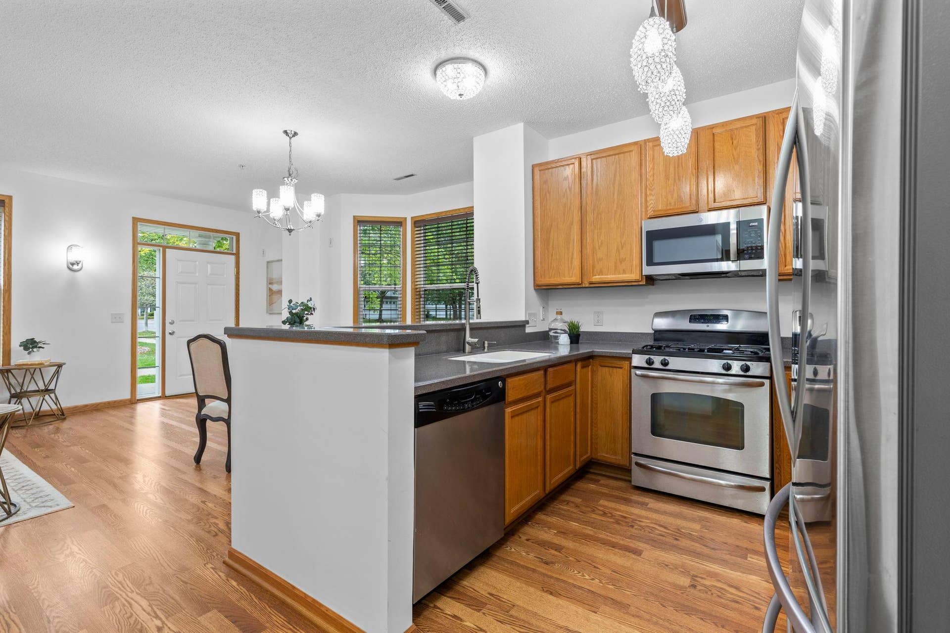 1626 Woodlynn Avenue, #1, Maplewood, MN 55109 An alternate view of the kitchen with views of the nearby dining room.