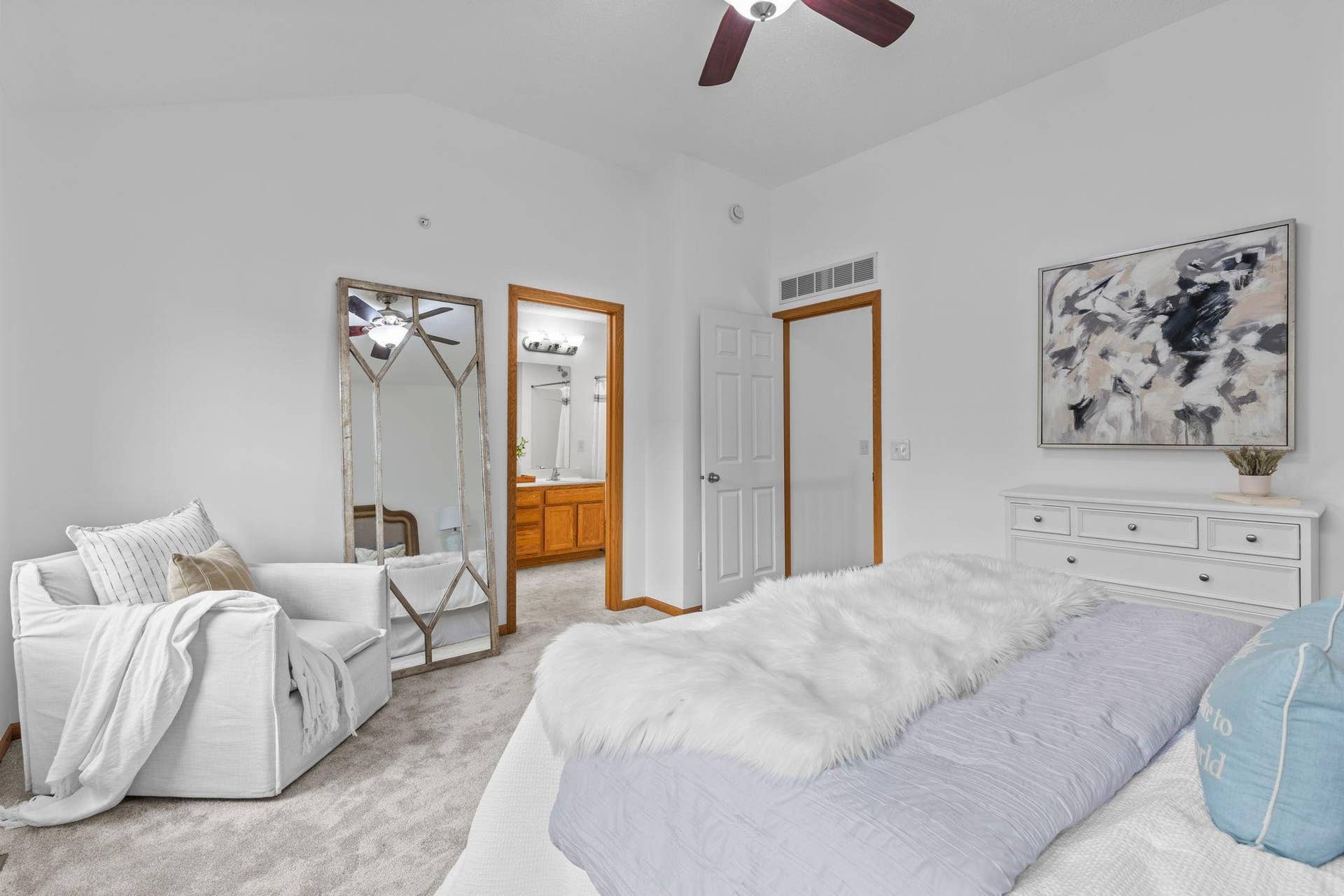1626 Woodlynn Avenue, #1, Maplewood, MN 55109 An alternate view of the primary bedroom showing access to the private ensuite bathroom and walk-in closet.