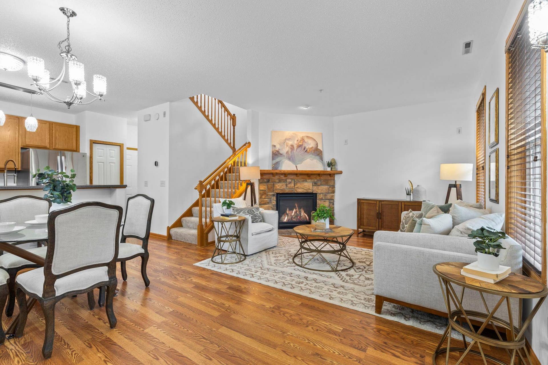 1626 Woodlynn Avenue, #1, Maplewood, MN 55109 Step inside to a bright, open-concept main level featuring brand-new warm-toned luxury plank flooring throughout.