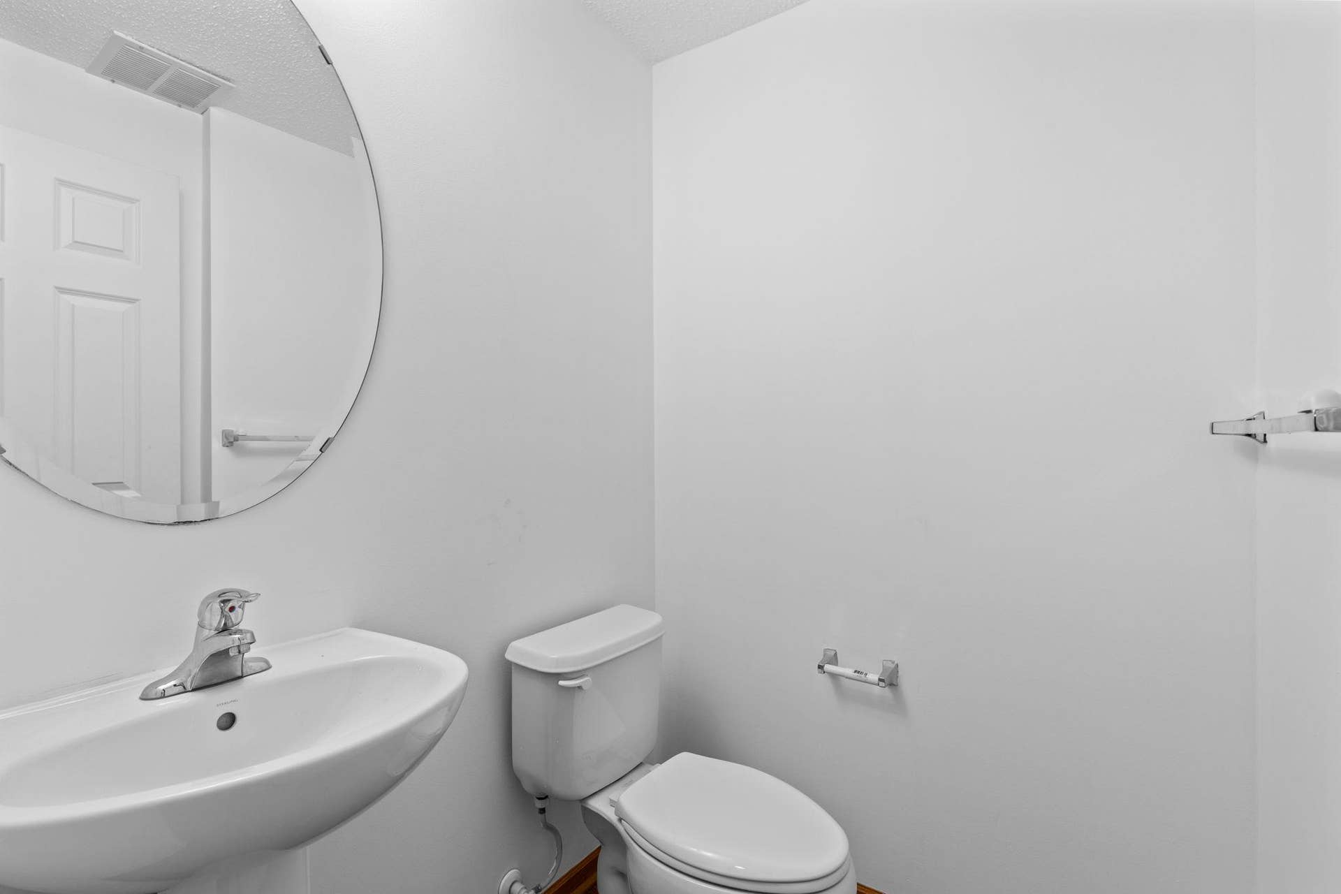 1626 Woodlynn Avenue, #1, Maplewood, MN 55109 The main-level 1/2 bathroom located near the entrance to the attached 2-car garage.