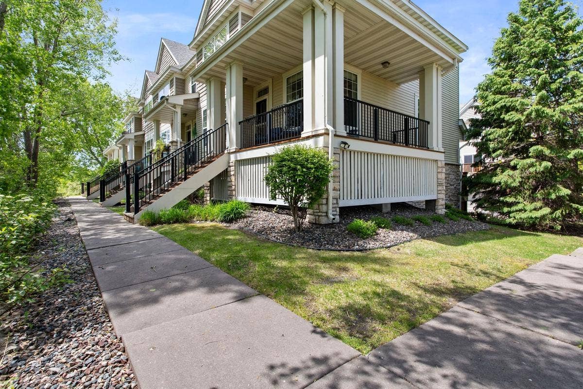 14633 Victor Hugo Boulevard N, #4, Hugo, MN 55038 Front porch with wrap around deck and views to pond and wetlands