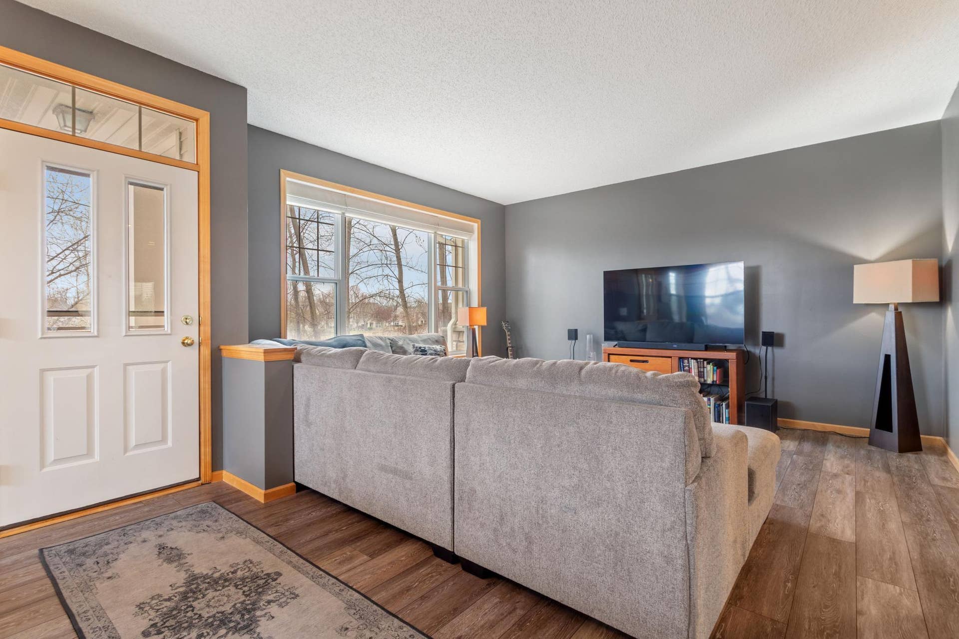 14633 Victor Hugo Boulevard N, #4, Hugo, MN 55038 Living Room with views to trees.