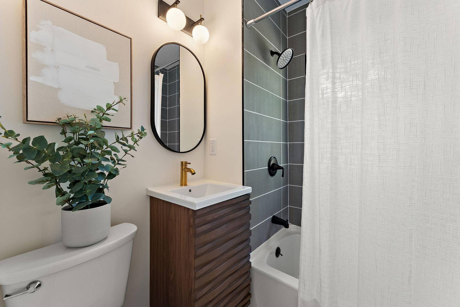 Brand new full bathroom with deep soaking tub, rainfall shower head, and shower tile