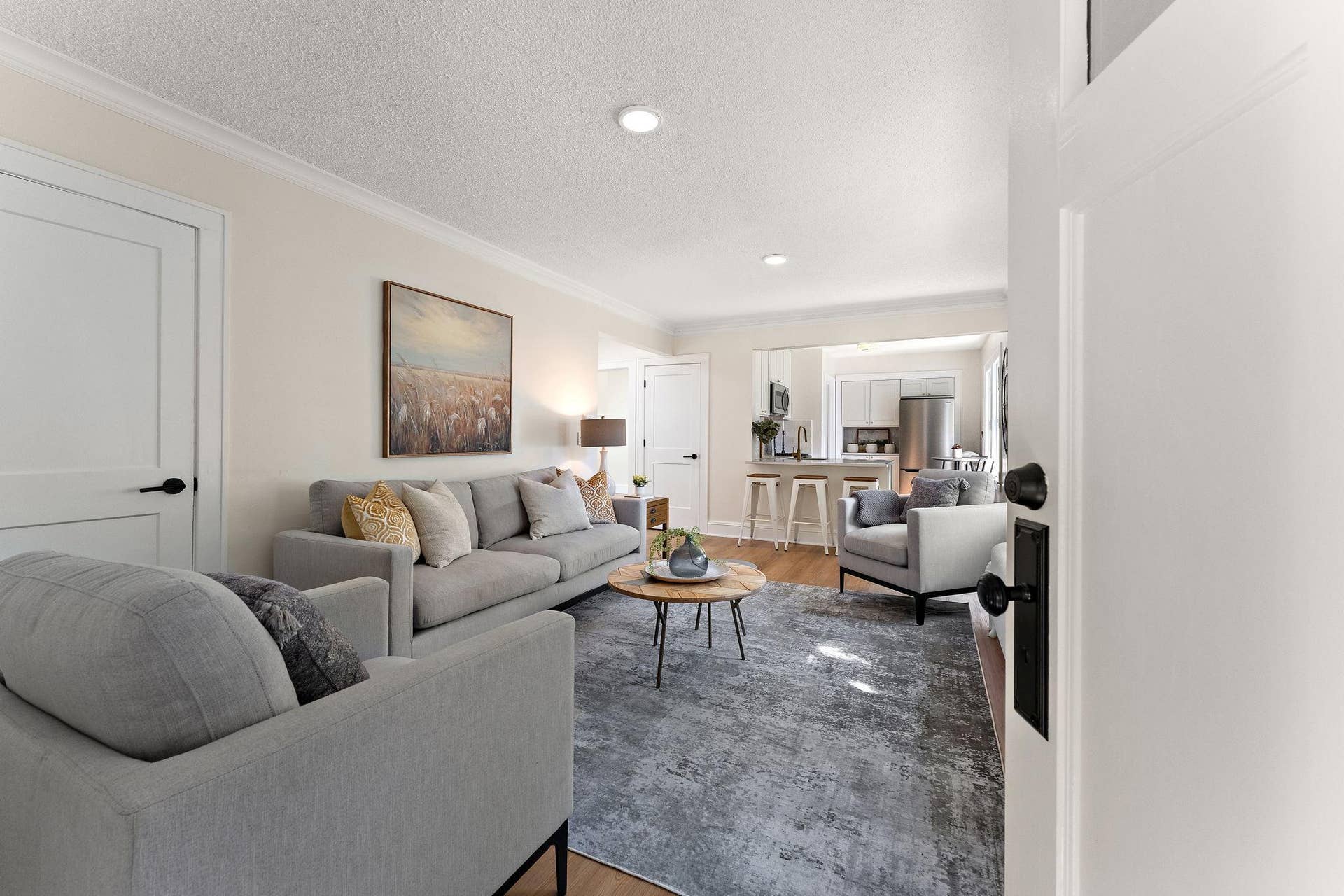 Spacious living room overlooking kitchen and dining