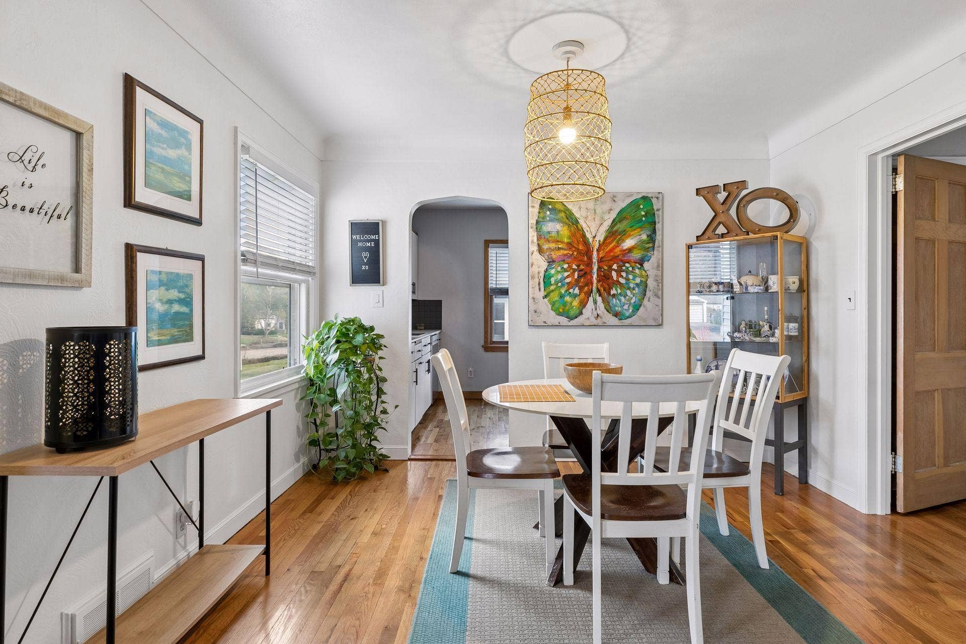 776 Parkview Avenue, 89, Saint Paul, MN 55117 Formal dining room with beautiful hardwood floors, abundant natural light, and charming arched doorway.