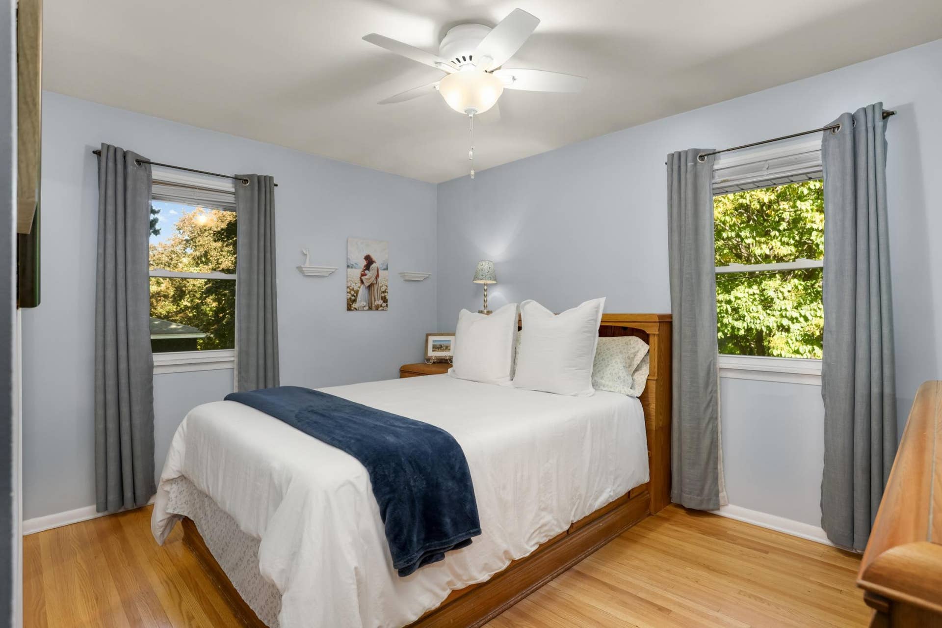 Primary bedroom on main floor offers spacious closet and newer windows