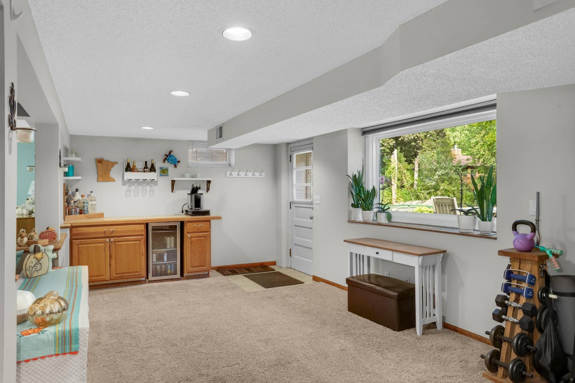 Corner gas fireplace, dry bar area and easy access to outside. Wonderful added space for any home office.