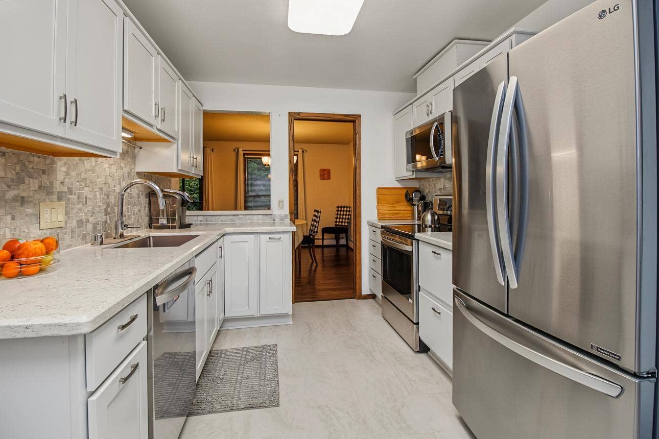 9700 Portland Avenue S, #128, Bloomington, MN 55420 Kitchen opens to dining and also features a breakfast bar.