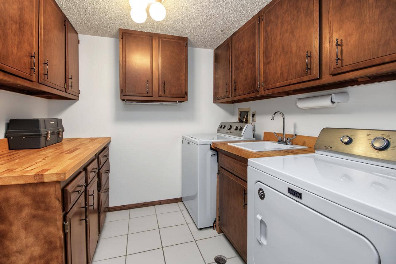 9700 Portland Avenue S, #128, Bloomington, MN 55420 Large laundry room with abundant storage.