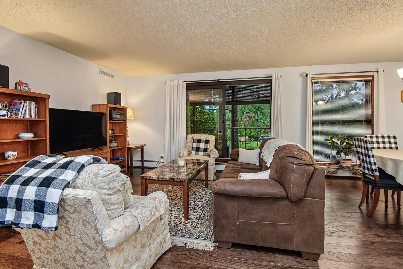 9700 Portland Avenue S, #128, Bloomington, MN 55420 Second look at the living room with adjacent screened porch.