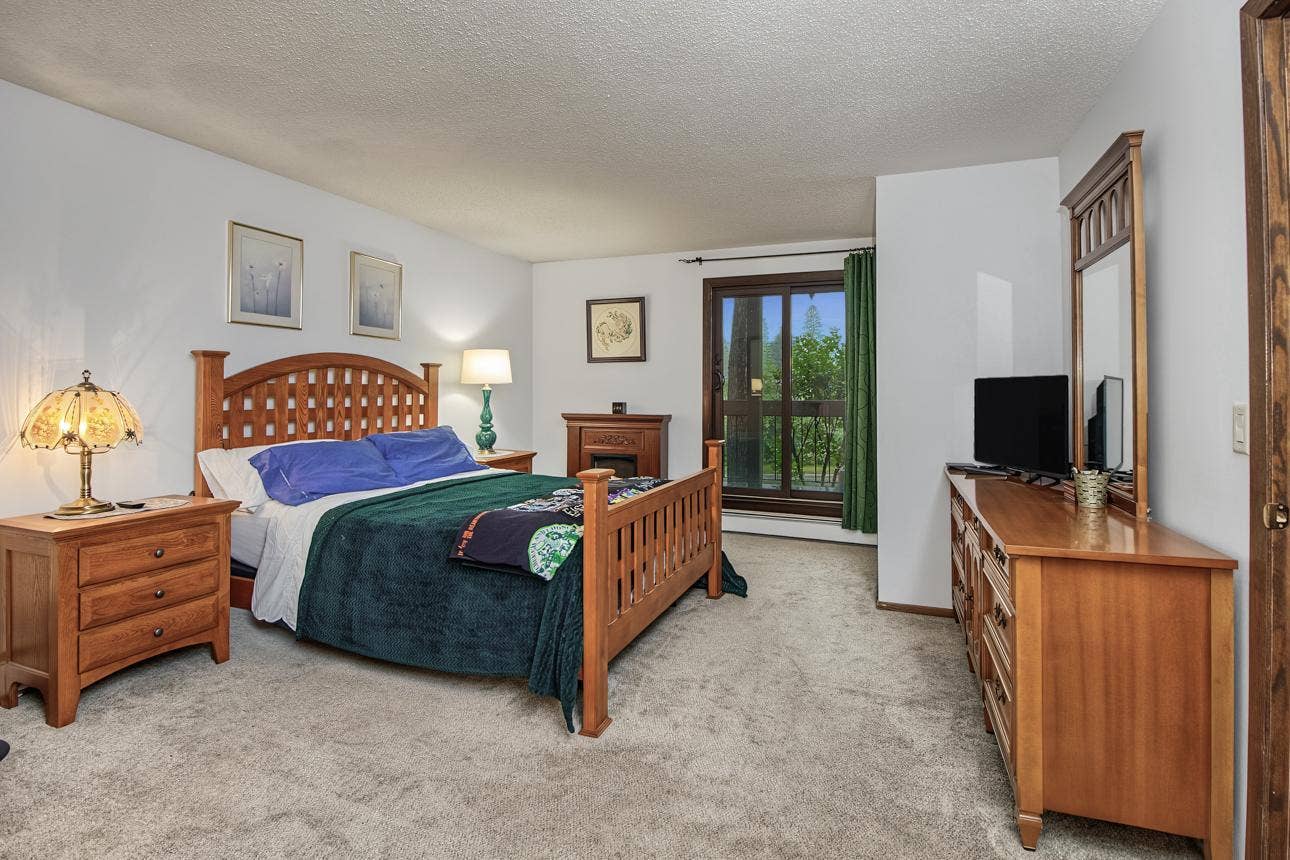 9700 Portland Avenue S, #128, Bloomington, MN 55420 Large primary bedroom with private balcony.