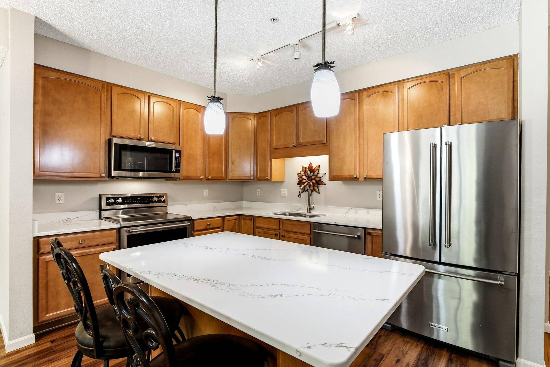 3800 85th Avenue N, #117, Brooklyn Park, MN 55443 Exceptional kitchen space with upgraded Corian counters, Stainless steel appliances, light fixtures and hardware. The perfect space for the chef in your home with sitting area