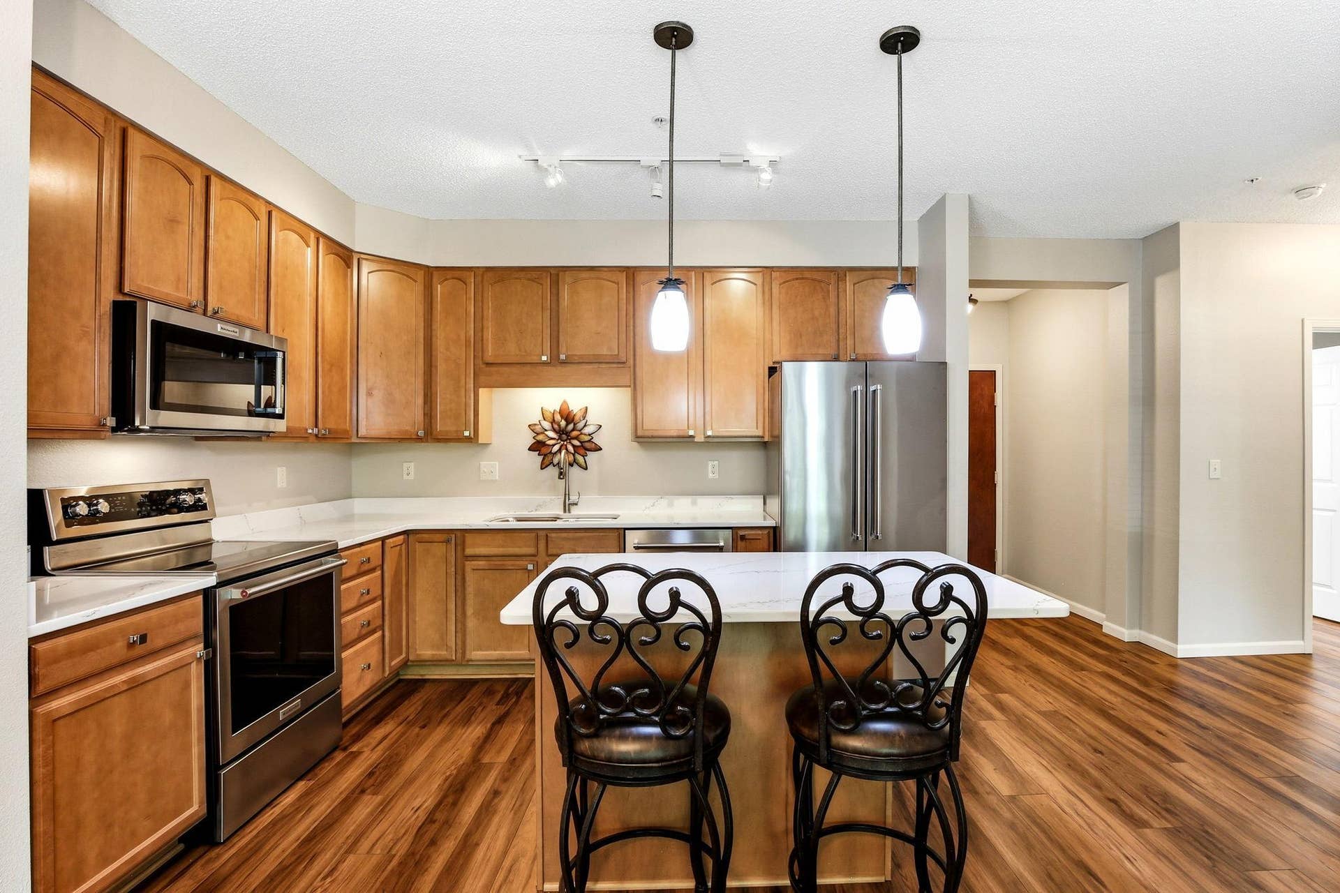 3800 85th Avenue N, #117, Brooklyn Park, MN 55443 Abundant cabinetry and a center island with seating area