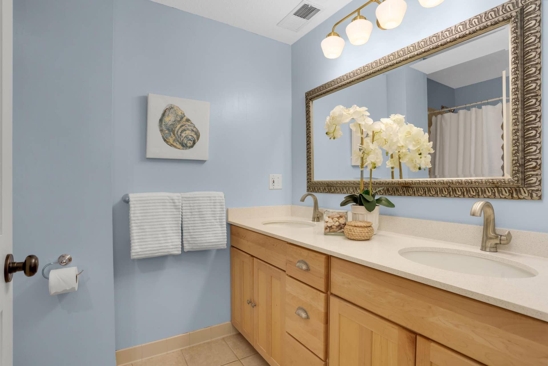 1117 Portland Avenue, 96, Saint Paul, MN 55104 Second floor bathroom conveniently located between primary and second bedroom is generously sized, with dual vanity and oversized tub.