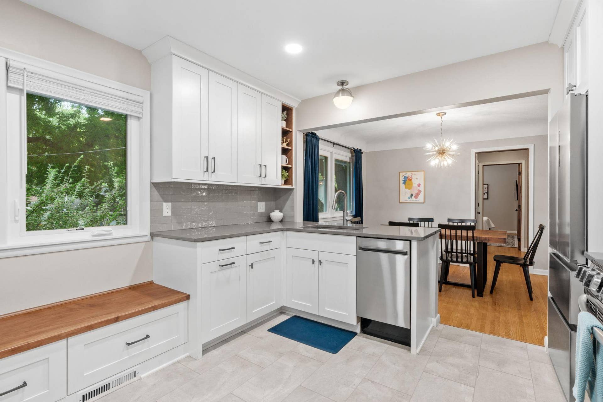 View of kitchen sink & dishwasher area + counter pennisula.