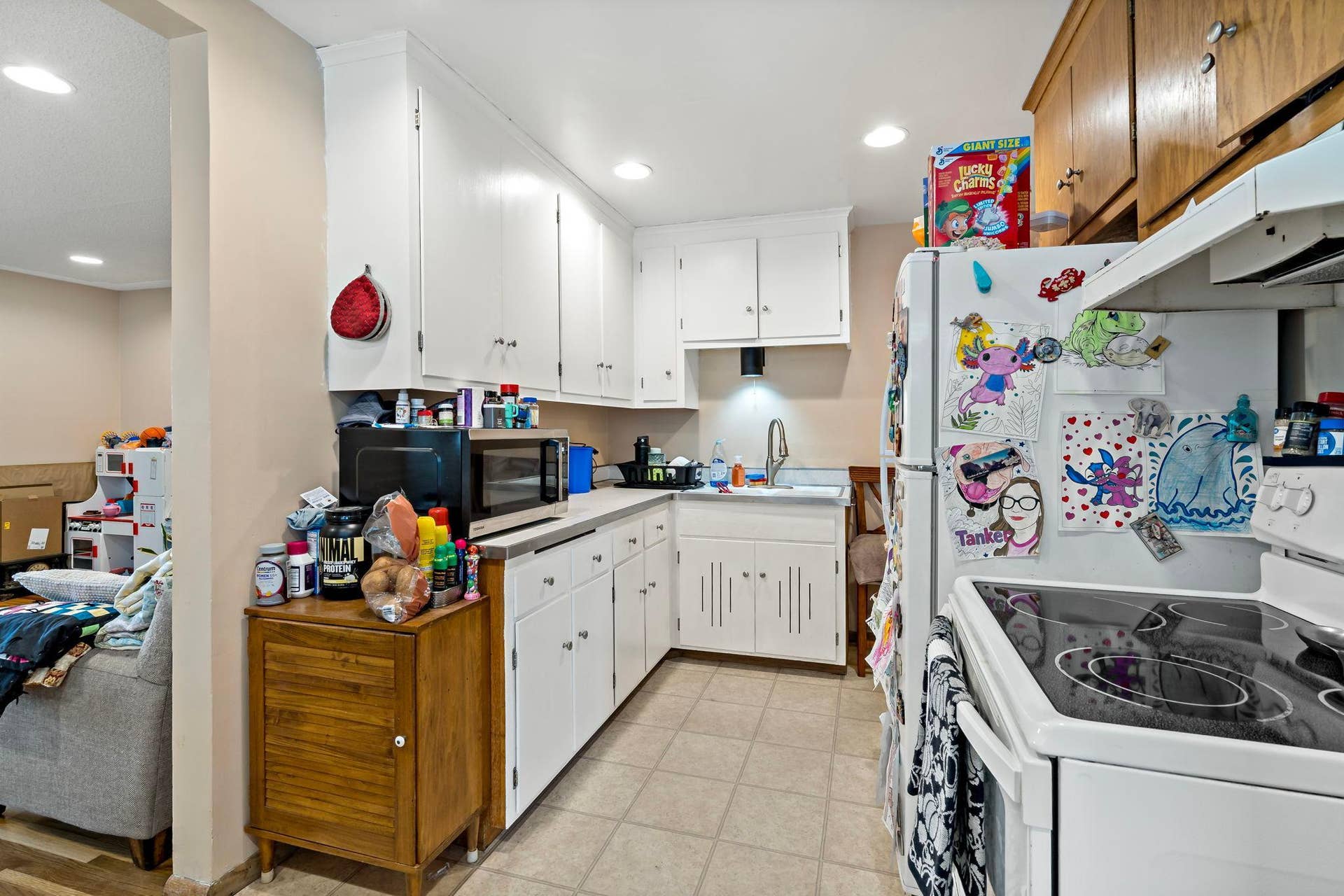 5749 Bloomington Avenue, 17, Minneapolis, MN 55417 Kitchen with electric range and refrigerator. Microwave is owned by the tenant.