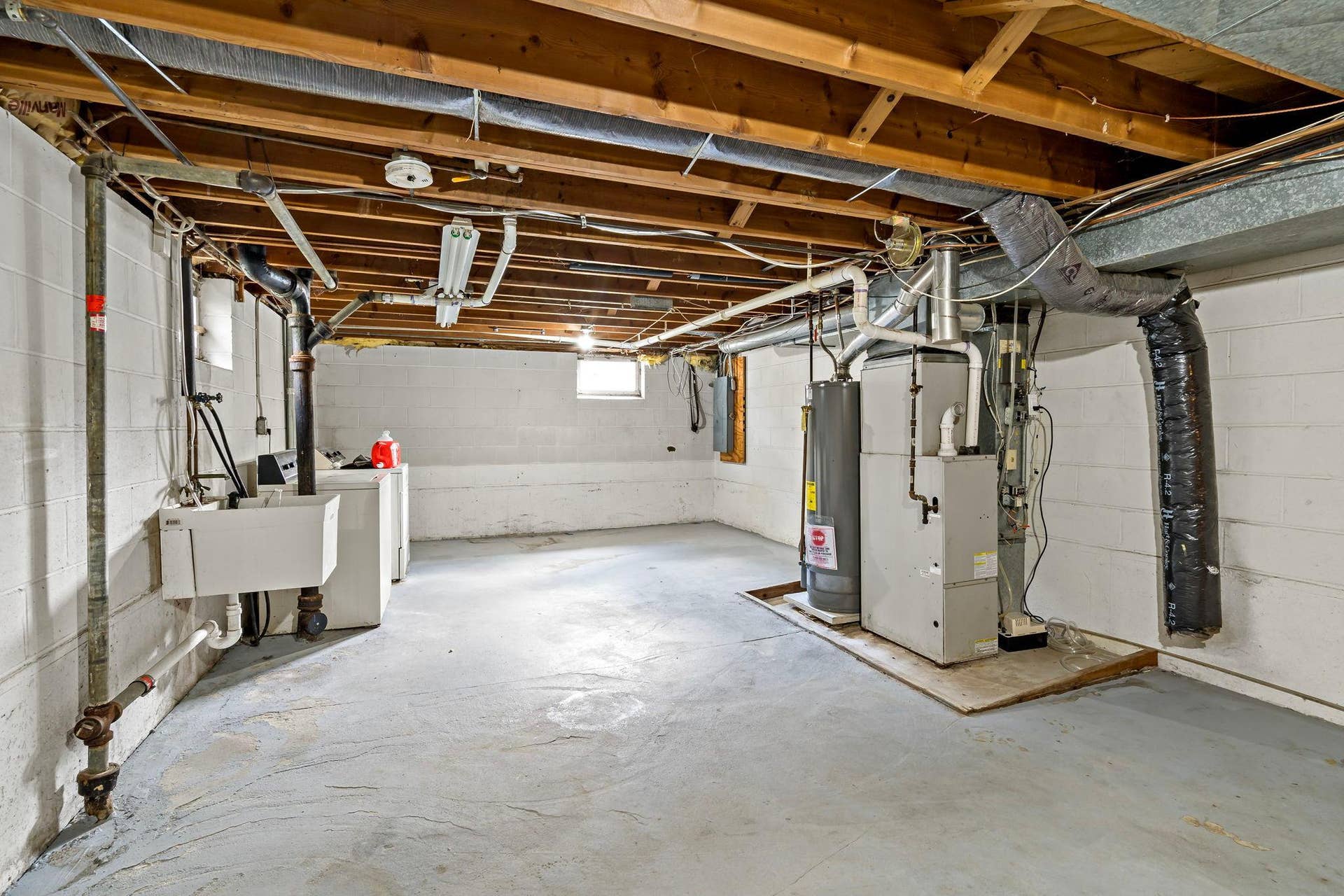 5749 Bloomington Avenue, 17, Minneapolis, MN 55417 Unfinished lower level utility area with washer/dryer and laundry sink.