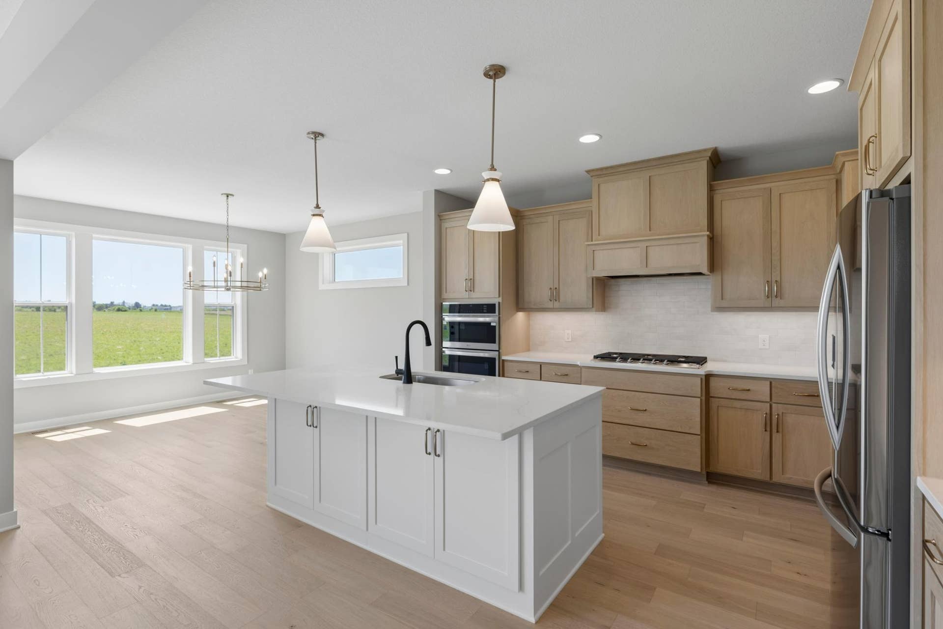10409 Blackmoor Road, Woodbury, MN 55129 Kitchen in open to spacious dining area(photo of actual listing) .