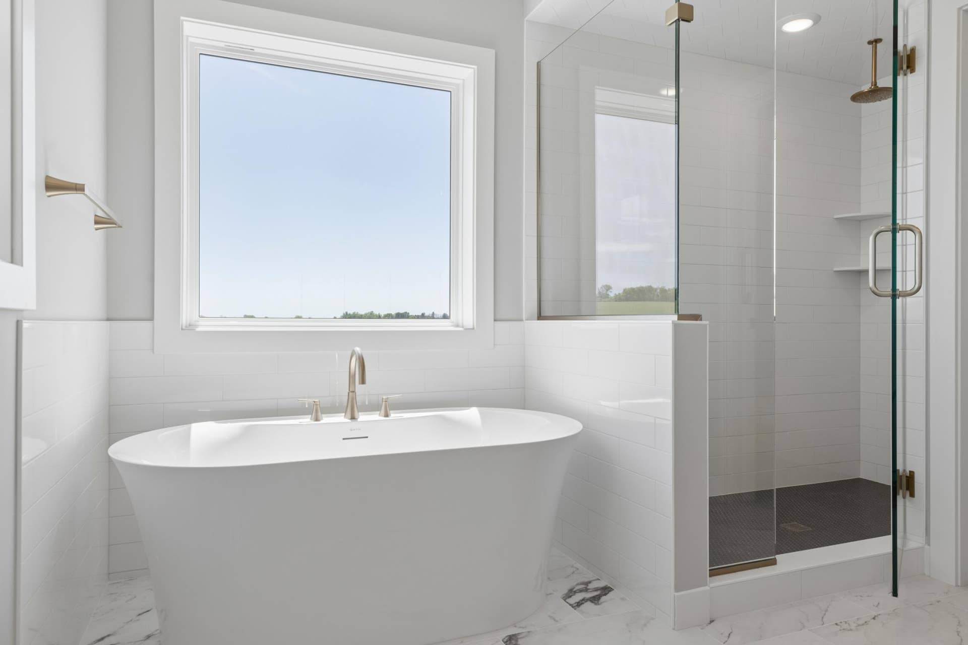 10409 Blackmoor Road, Woodbury, MN 55129 Freestanding tub, ceramic tile floors and walls plus two separate windows in primary bath (photo of actual listing).