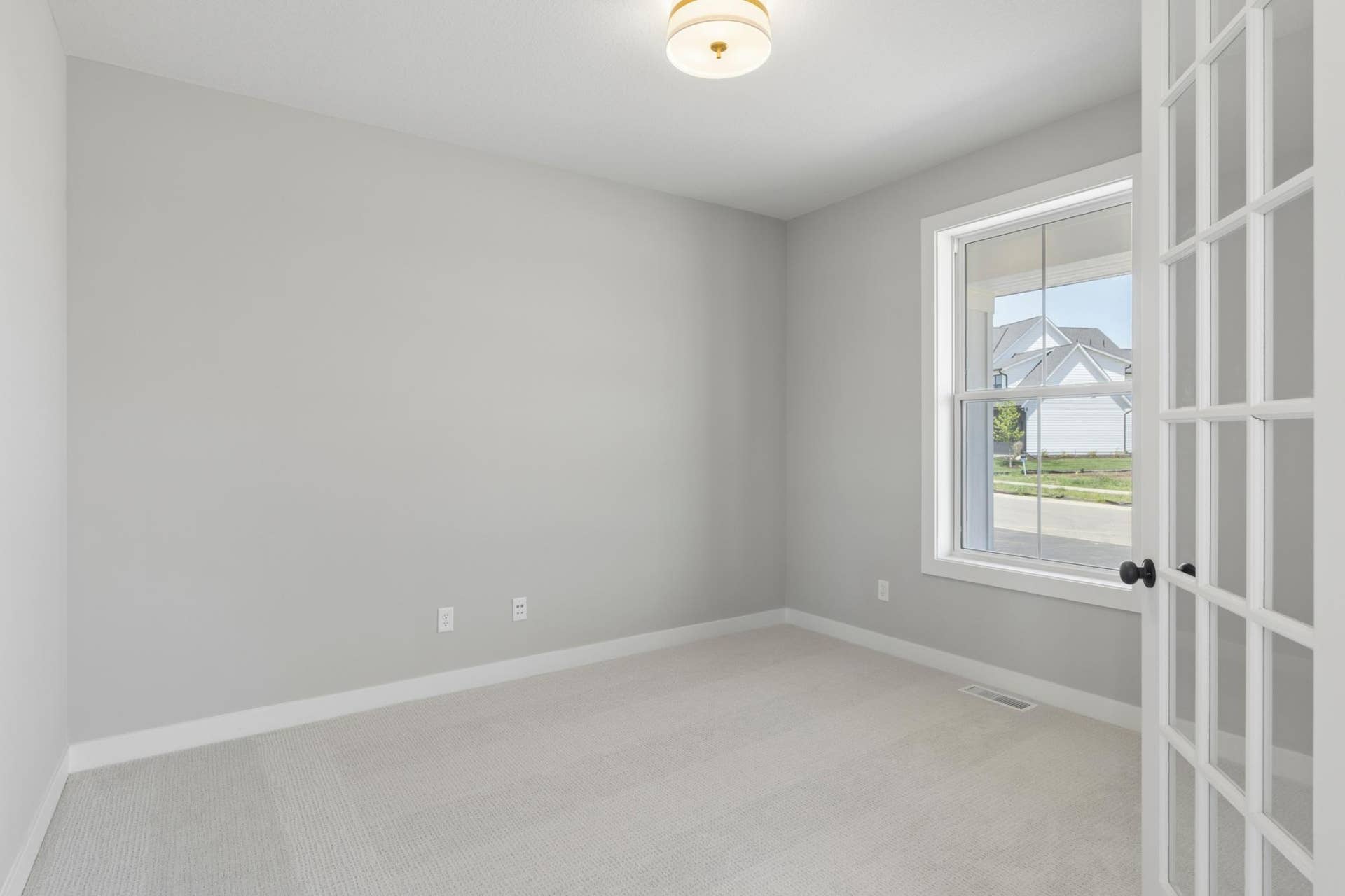 10409 Blackmoor Road, Woodbury, MN 55129 Large flex room at entrance of home makes for a great office (photo of actual listing).