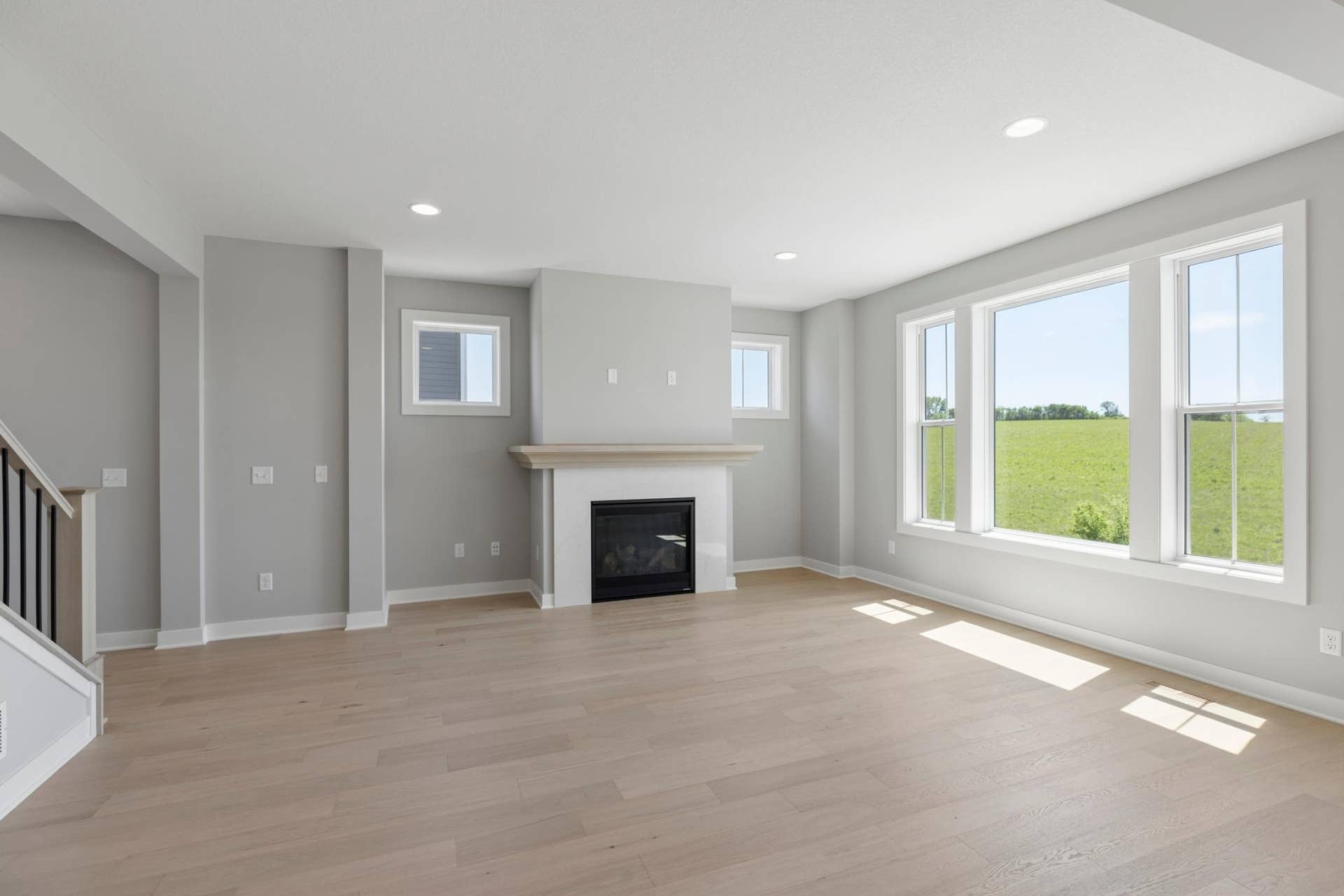 10409 Blackmoor Road, Woodbury, MN 55129 Main floor gathering room features loads of light from southern exposure (photo of actual listing).