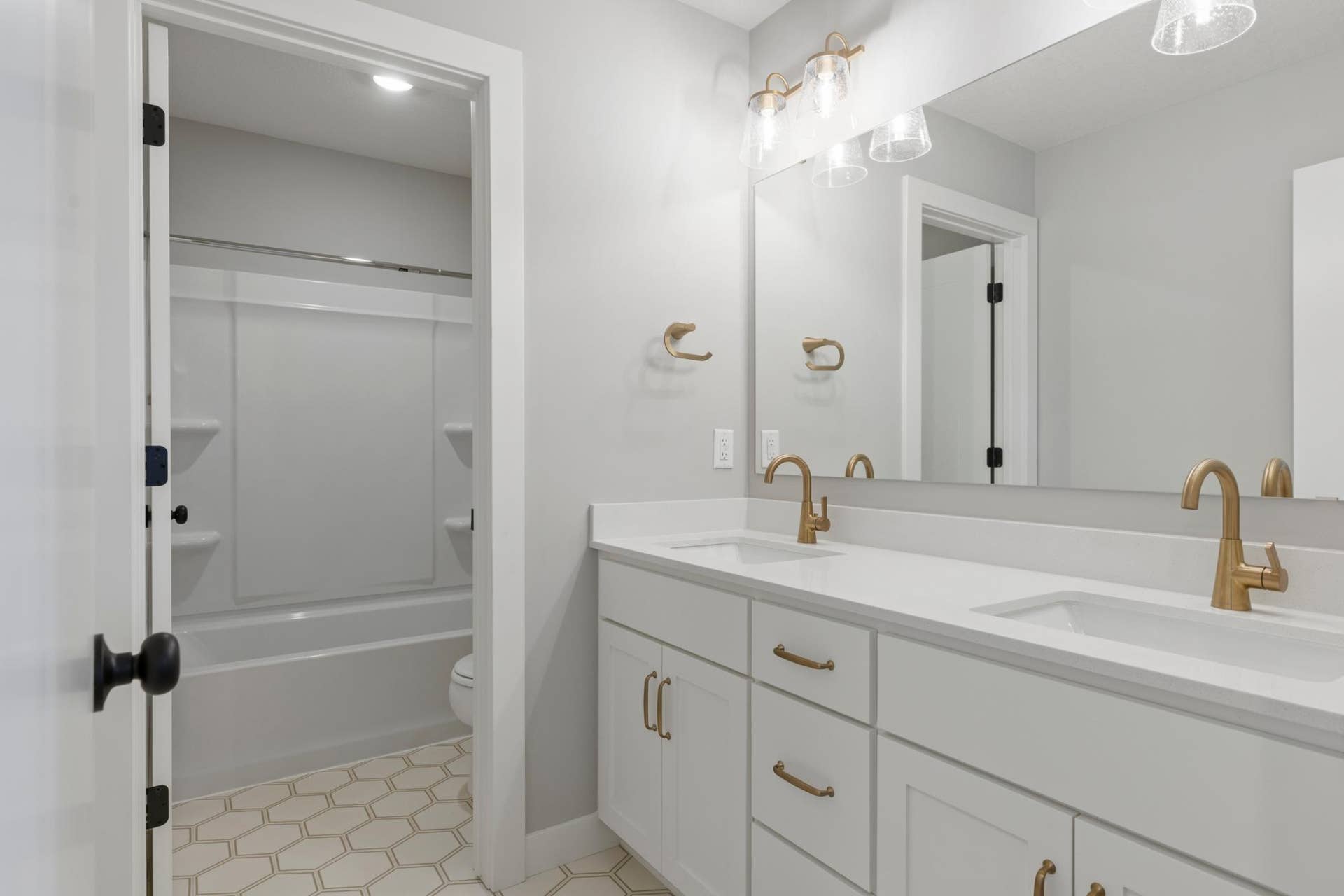 10409 Blackmoor Road, Woodbury, MN 55129 Upstairs hall bath includes double sink vanity and separate room for tub (photo of actual listing).