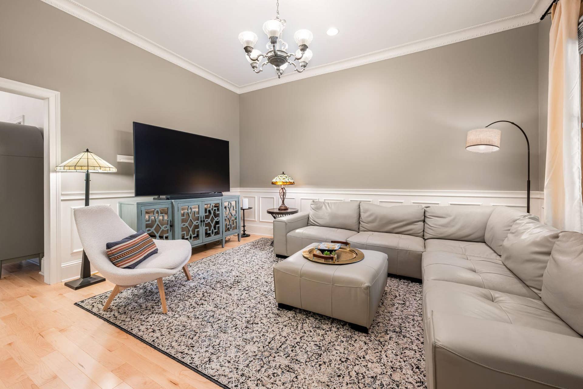 The airy, and bright living room invites you in.