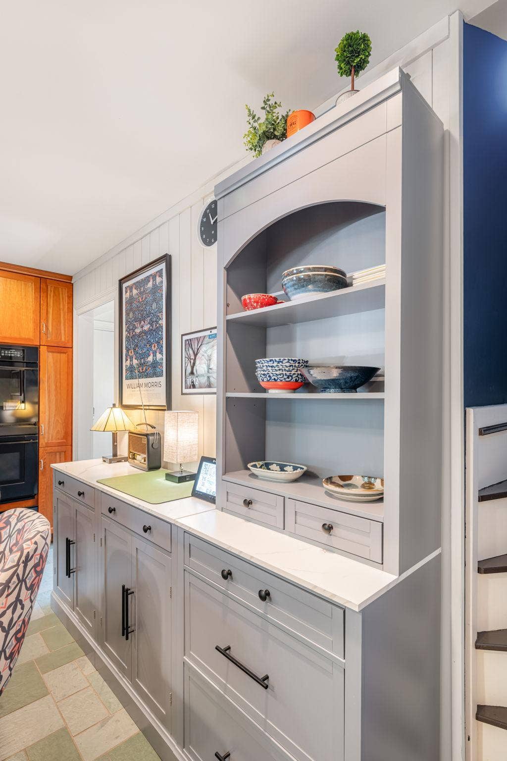 This piece adds tons of storage and would be a great spot for a coffee bar!