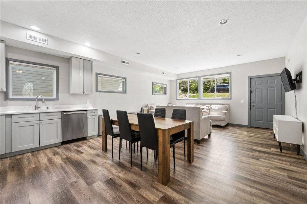 211 Belvidere Street E, 104, Saint Paul, MN 55107 211-Belvidere-Street-E-Saint-Paul-MN-55107-14-Open-Living-and-Dining-AI-Edited.jpg