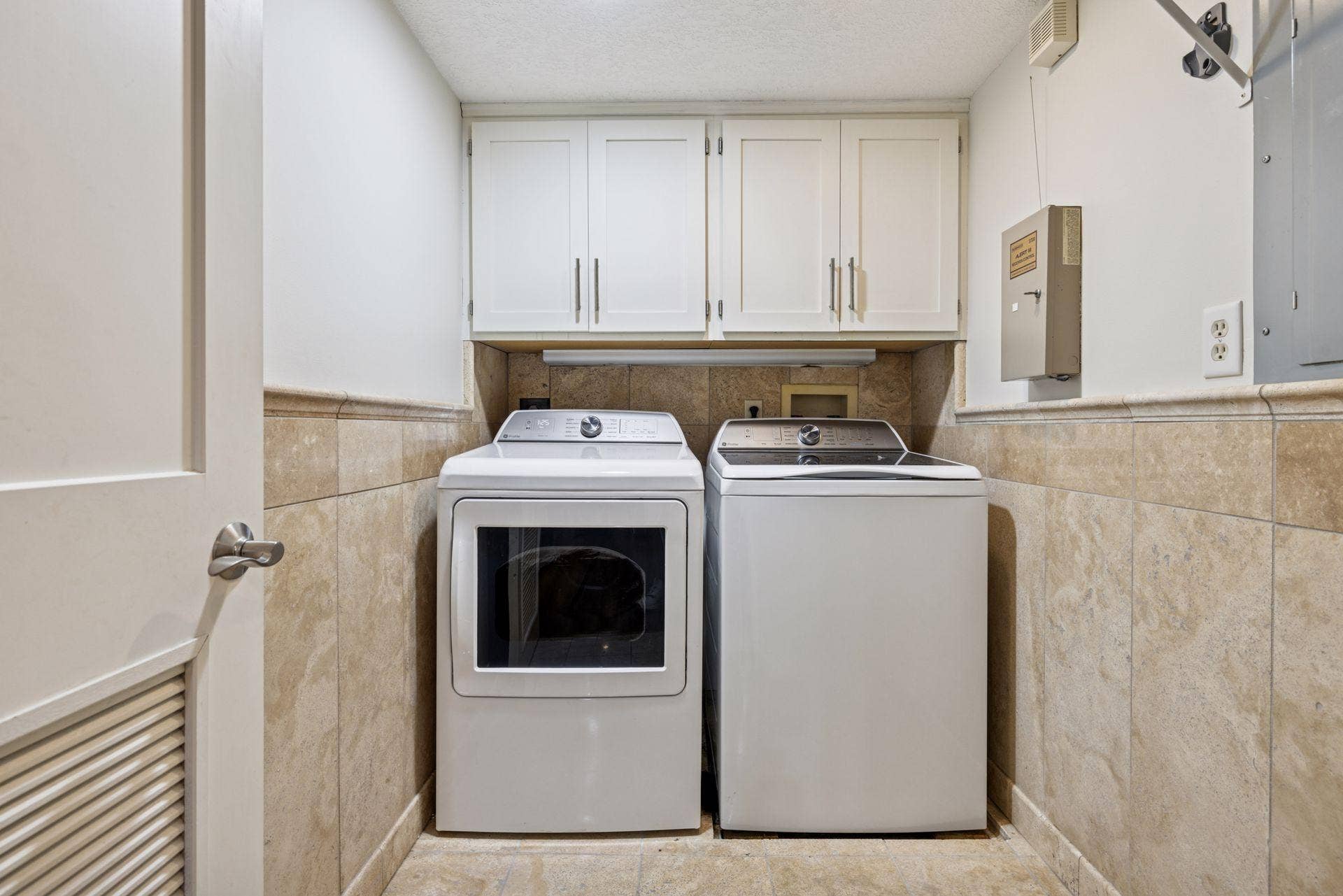 3150 Glen Oaks Avenue, #311A, White Bear Lake, MN 55110 Private in unit laundry featuring newer washer and dryer and cabinets.