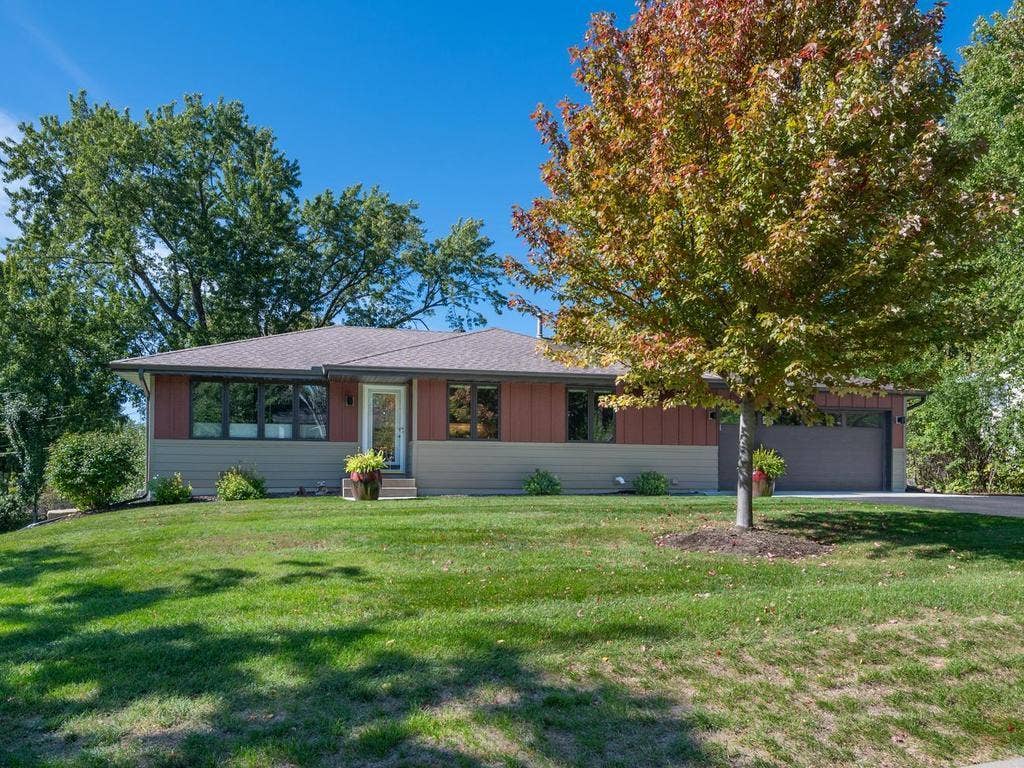 13008 Lakeview Drive Drive, Burnsville, MN 55337 Mature trees and a spacious front lawn add to the homes curb appeal.