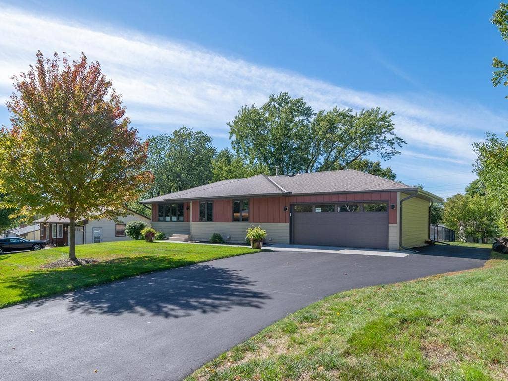 13008 Lakeview Drive Drive, Burnsville, MN 55337 The extended driveway provides convenient additional parking alongside the two-car garage.
