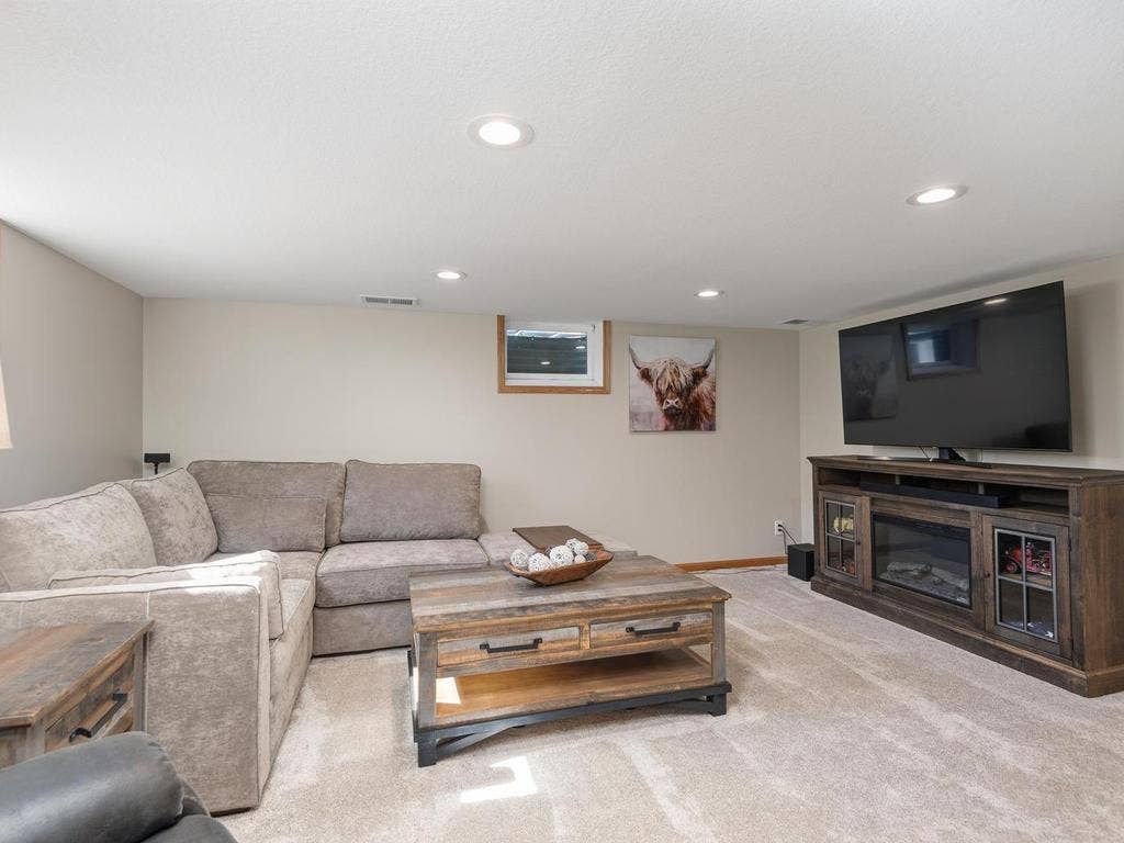 13008 Lakeview Drive Drive, Burnsville, MN 55337 The spacious lower-level amusement room offers plenty of room for seating and entertainment.