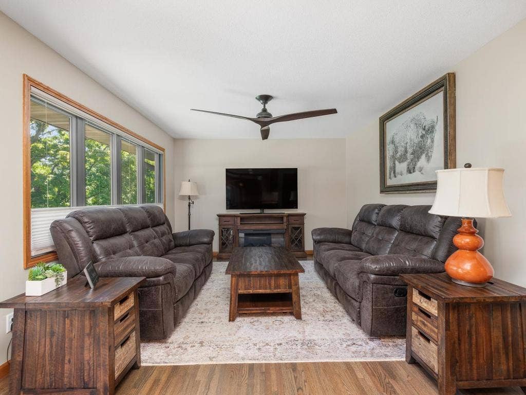 13008 Lakeview Drive Drive, Burnsville, MN 55337 Large windows bring natural light into the main-level living room.